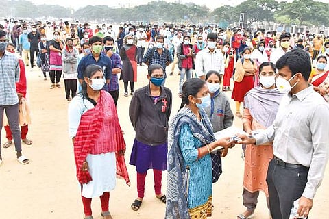 Coimbatore Corporation Commissioner Raja Gopal Sunkara distributing medical kits to frontline staff