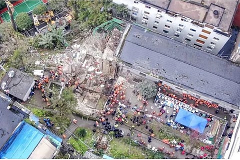 Emergency officials work at the site of an explosion in southwestern China (Source: AP)