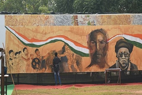 A picture of an artist working on a painting (Image credit: ANI)