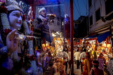 A priest performs evening prayer (Credit: Reuters)