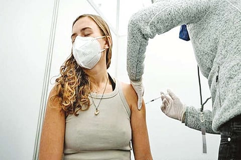 A women taking Covid vaccine