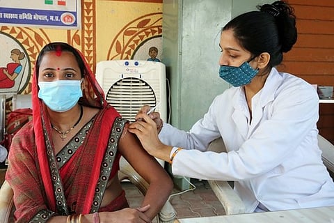 A citizen getting her vaccination dose (Source: ANI)