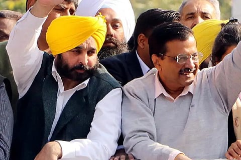 Arvind Kejriwal and Punjab AAP President Bhagwant Mann during a road show (Photo: ANI)