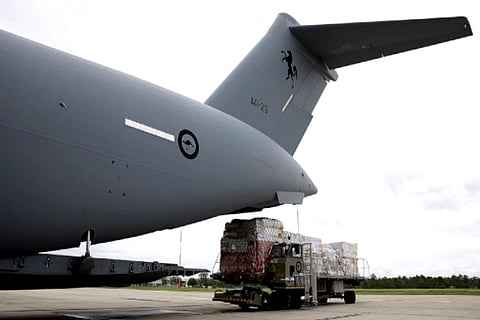 Royal Australian Air Force C-17A Globemaster III aircraft is loaded with aid (Credit: AP)