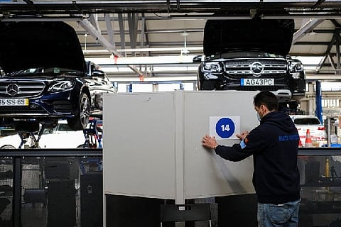 Polling booth in an auto repair shop.