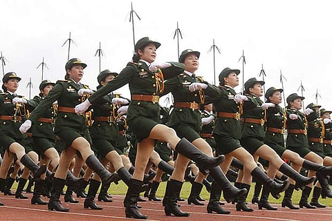 Vietnamese soldiers from a communication unit march during the 60th anniversary celebrations