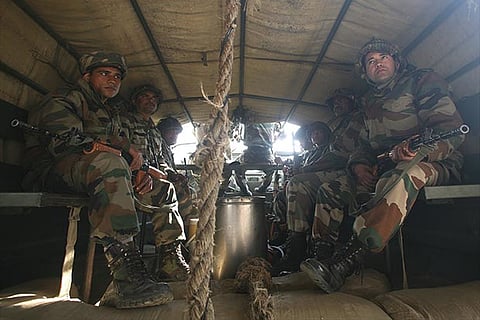 Indian army soldiers head towards the Indian Air Force (IAF) base at Pathankot in Punjab