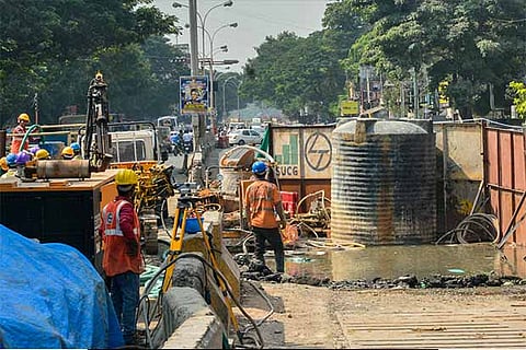 Workers contain the damage caused after they drilled into a water pipe on Poonamallee High Road