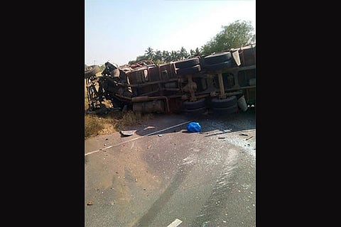 The TNSTC bus lying on its side after colliding with a lorry in Madurai district