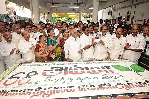 A giant 68 kg cake was cut by ministers at the party headquarters in the city