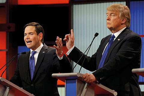 Republican US presidential candidate Marco Rubio (L) and rival candidate Donald Trump at the Detroit