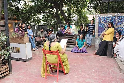 Participants attend an open mic session of slam poetry organised by Mocking Birds