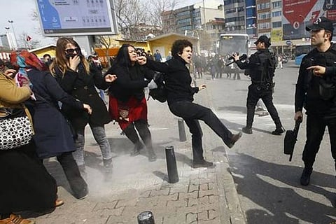 Police use rubber pellets to disperse participants in a rally on Sunday