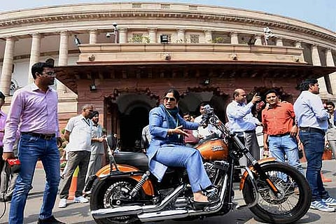 Ranjeet Ranjan, Lok Sabha MP, rides a Harley-Davidson bike at Parliament