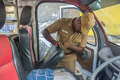 Police personnel conduct checks on vehicles in the city in the run-up to the Assembly elections