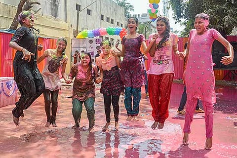 Youngsters playing Holi in Chennai city (Photos: Justin George and Prakaash)