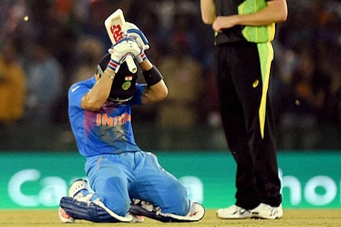 Indian batsman Virat Kohli celebrates after winning the ICC World T20 match against Australia