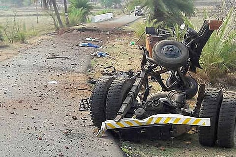 Mangled remains of a CRPF vehicle in the aftermath of a Naxal attack