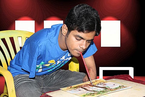 Janarthanan giving finishing touches to his painting