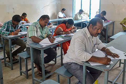 A group of candidates in their 30s and 40s giving their Class 8 exam (Photo: Justin George)