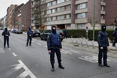 Police at the scene of a security operation in the Brussels suburb of Molenbeek in Brussels