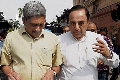 Minister Manohar Parrikar interacts with Subramanian Swamy after the debate on AgustaWestland scam