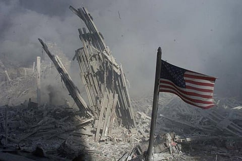 An American flag flies near the base of the destroyed World Trade Center in New York