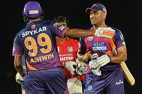 Rising Pune Supergiants skipper MS Dhoni and R Ashwin celebrate after wining the match
