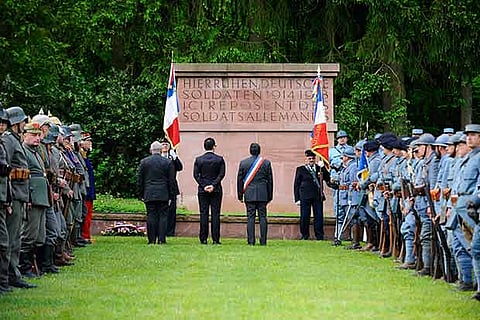 Residents dressed as French and German soldiers gathered at the WWI cemetery to pay their respects