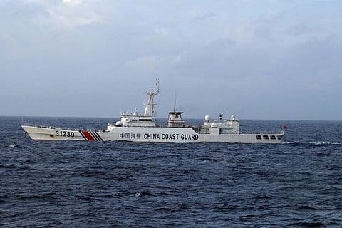 Chinese coast guard vessels travel in the disputed islands, first time a navy ship has been spotted