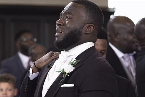 Groom reacts adorably to bride walking down the aisle