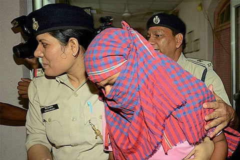 Ruby Rai taken away by police