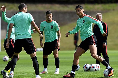 Cristiano Ronaldo (right) along with his team-mates during a training session