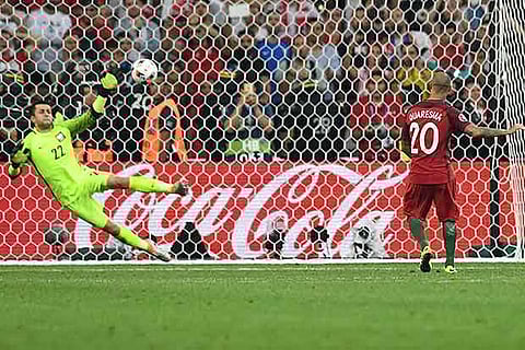 Portugal?s forward Ricardo Quaresma (right) scores the winning goal in a penalty shootout