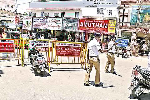Cops regulating motorists after the new arrangement on South Mada Street in Mylapore on Wednesday