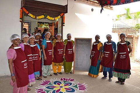 Cheerful residents of Banyan Adaikalam strike a pose outside the newly opened Nalam Caf?