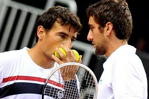 Ivan Dodig (L) and Marin Cilic chat during a Davis Cup match