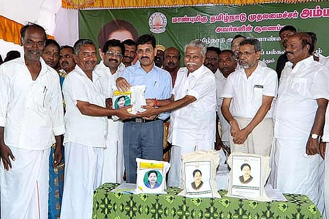 File photo of Agriculture minister R Doraikannu distributing seeds to farmers
