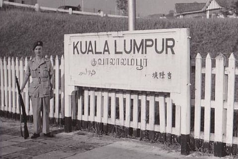 A sign board in Tamil and English at a railway station in Malaysia