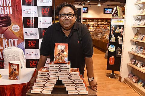 Indian author Ashwin Sanghi with his latest book The Sialkot Saga