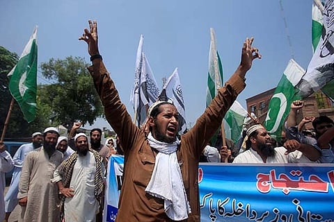 Supporters of JuD chant anti-India slogans during a protest against Rajnath's visit to Pakistan
