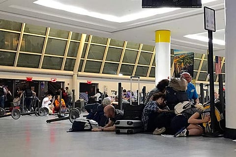 Travellers run for cover at New York?s JFK airport after hearing gunshots