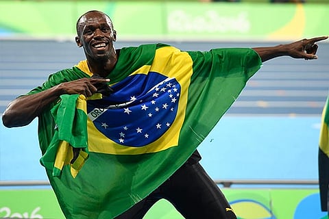 Usain Bolt celebrates after anchoring Jamaica to 4x100m relay gold