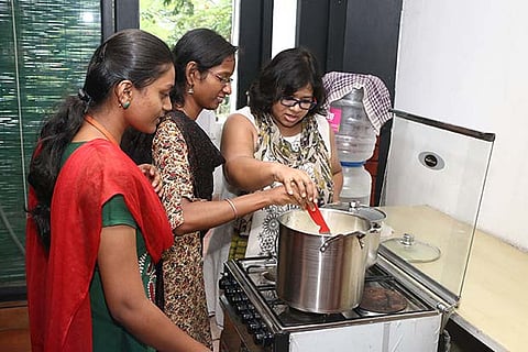 Namrata Sundaresan (right) helps her employees make cheese (Photo: Prakaash)