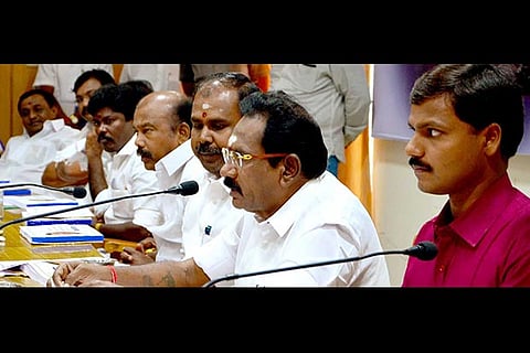 Minister Sellur K Raju (second from right) addressing a meeting in Madurai