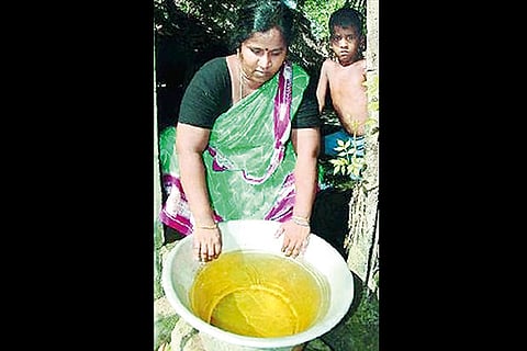 Picture of resident with contaminated water