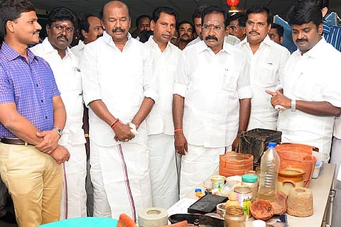 Health Minister Vijaya Baskar (right) and officials inspect the exhibition in Madurai