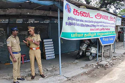 Police personnel stand guard at Rajaji Salai, in the city