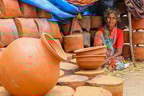 Karupayee sits at the Vyasarpadi stall to sell pots
