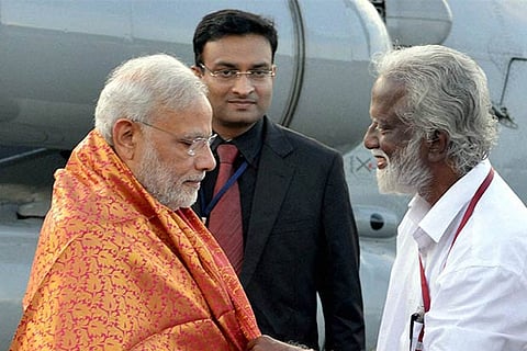 PM Modi being received by Kerala BJP head Kummanam Rajashegaran at Kozhikode airport